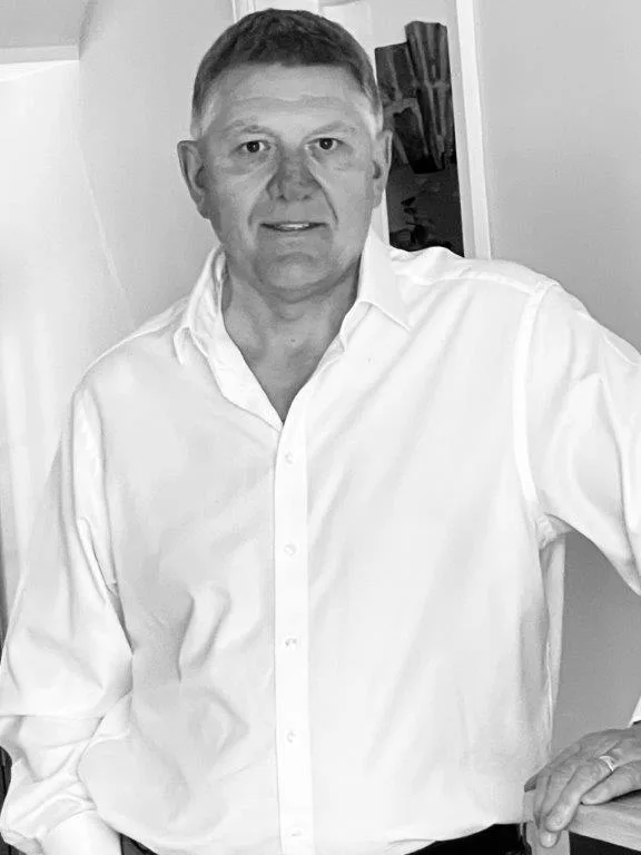 Black and white portrait of Adam Johnson